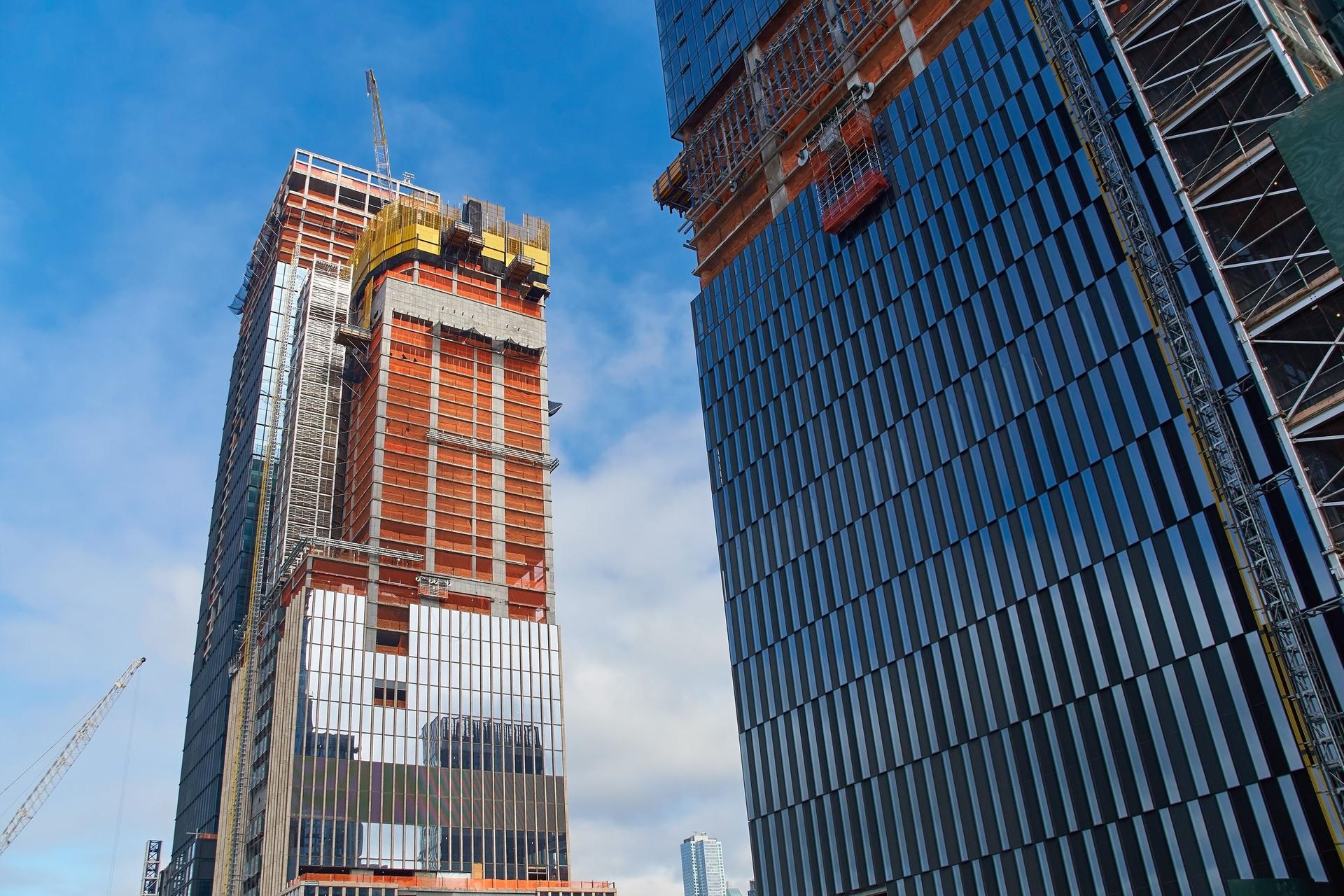 Skyscrapers under construction in New York city at daytime.