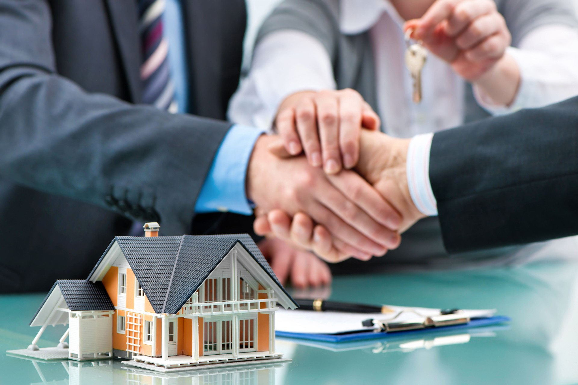 Handshakes with customer after contract signature